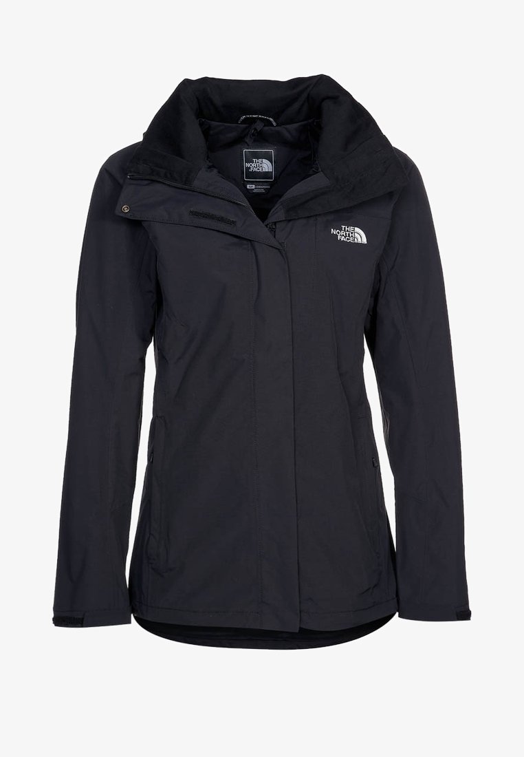 Veste noire imperméable The North Face avec col montant, fermeture à glissière intégrale à l'avant, poches latérales et logo sur le côté gauche de la poitrine.