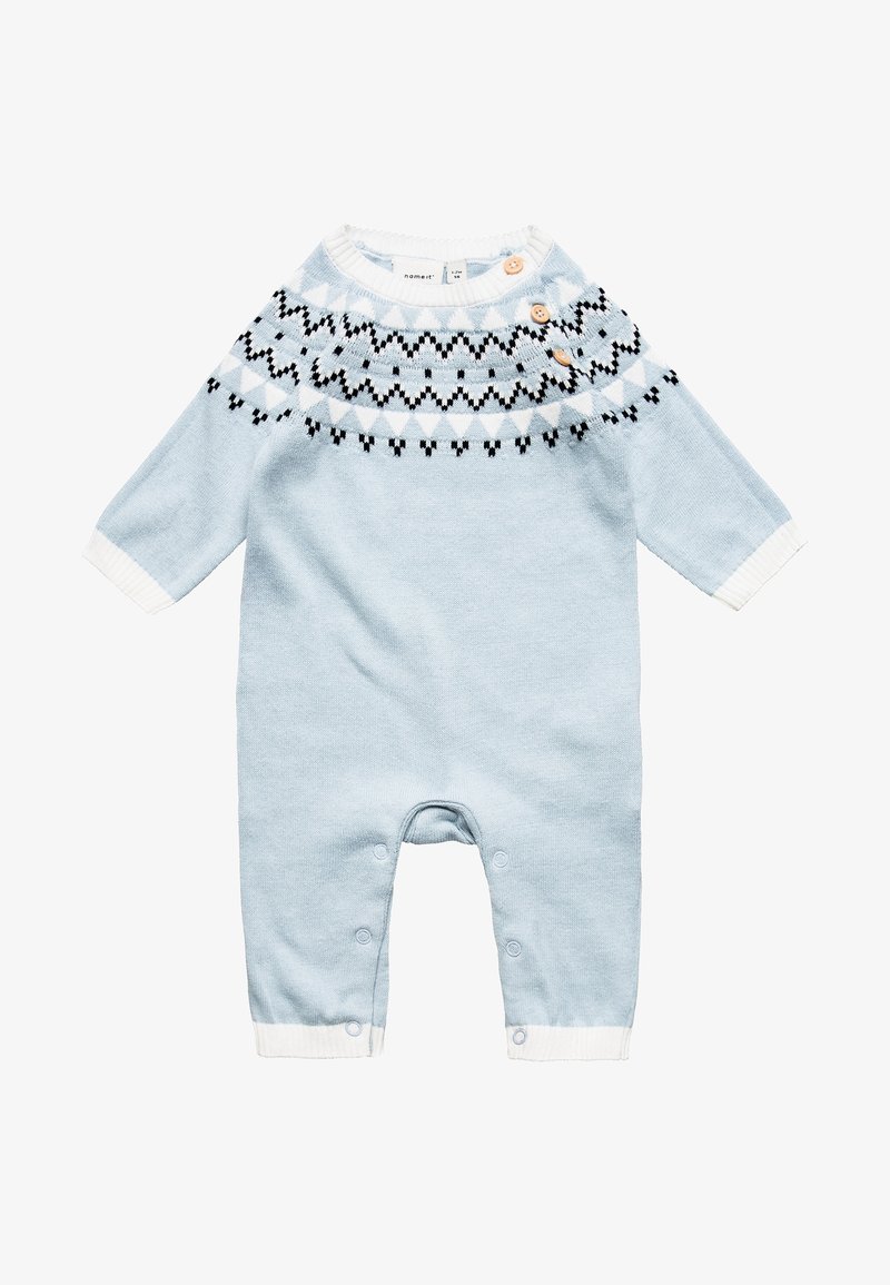 Barboteuse bébé bleu clair avec poignets blancs, motif géométrique noir et blanc sur le plastron, et trois boutons en bois près de l'encolure.