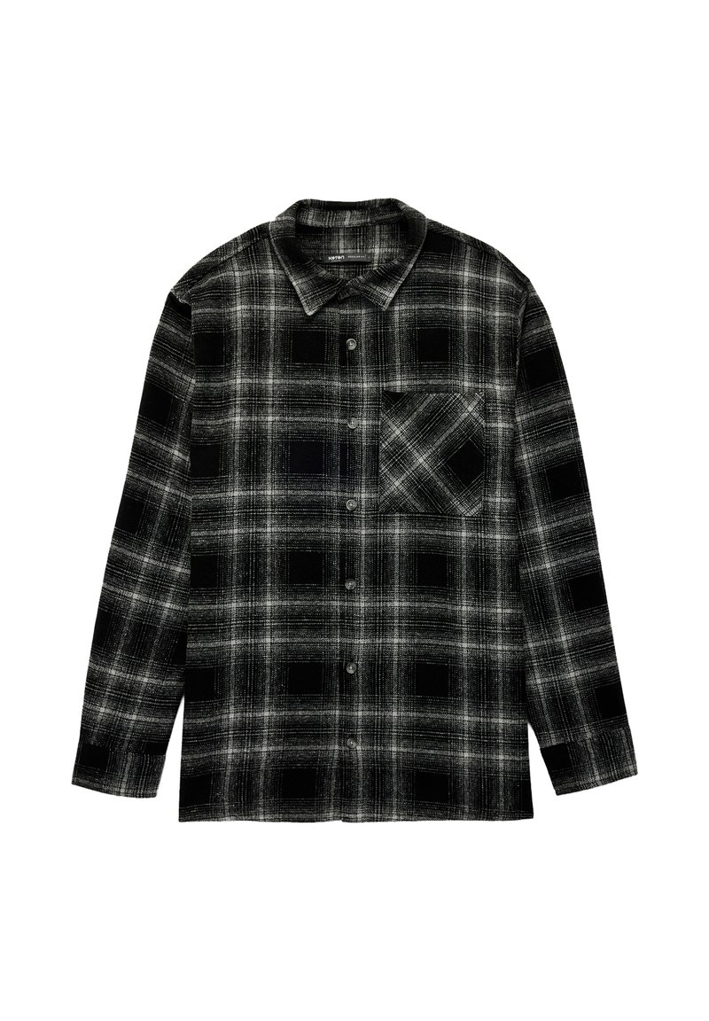 Mustavalkoinen ruudullinen paita nappikauluksella, pitkällä hihalla ja rintataskulla, jossa on neliökuvio. Valmistettu kudotusta kankaasta.