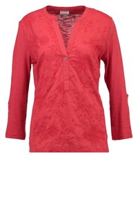 Haut rouge à manches longues avec un décolleté en V et des motifs floraux brodés. Présente un accent de bouton à l'avant et une finition texturée.