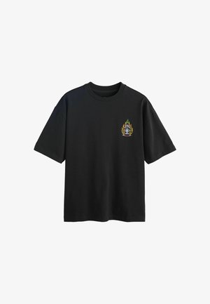 Black short-sleeve T-shirt with small graphic of a flaming hot sauce bottle on the left chest area.