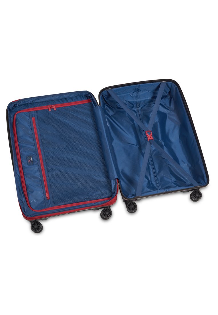 Maleta rígida en azul marino con acentos rojos, que cuenta con dos compartimentos, uno de ellos con un bolsillo de malla con cremallera y correas cruzadas para asegurar el contenido.