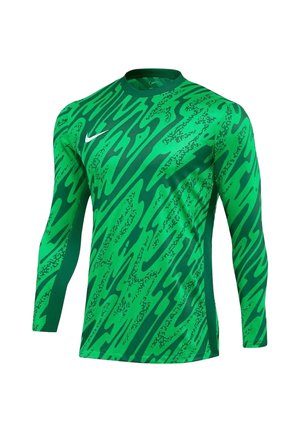 Zielona sportowa koszulka z długim rękawem z ciemnozielonym abstrakcyjnym wzorem i białym logo Nike na piersi, przedstawiona na białym tle.