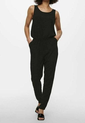 Combinaison noire sans manches avec taille élastique, poches latérales et jambe fuselée. Tissu doux et style minimaliste.