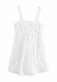 Vestido blanco sin mangas de algodón con diseño de volantes, que presenta patrones florales bordados en la tela y tirantes con forma de ondas.