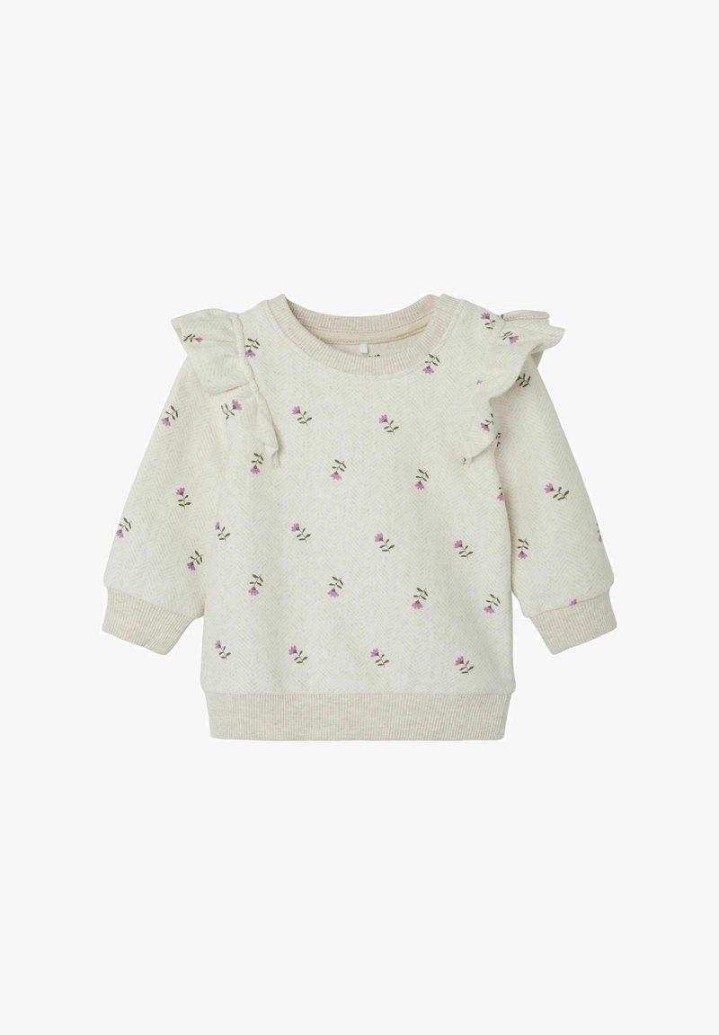 Felpa beige chiaro con stampa floreale, dettagli arricciati sulle spalle, scollatura a girocollo e polsini e orlo elasticizzati. Tessuto morbido e testurizzato.