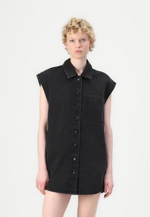 Black denim shirt dress with short sleeves, button front, and a chest pocket. The fabric has a smooth texture and a classic collar design.