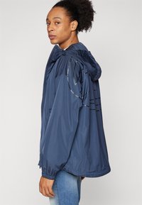 Diesel CLOG - Windbreakers - blue