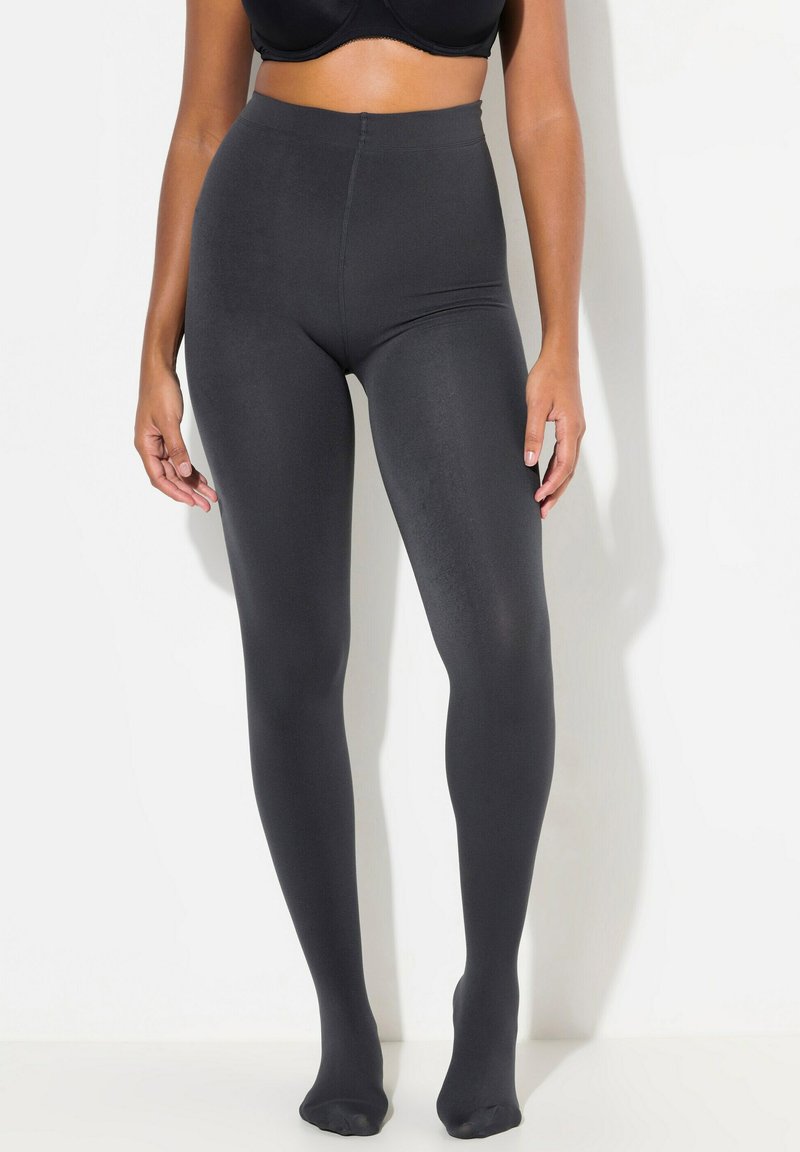 Leggings neri a vita alta realizzati in tessuto elastico, caratterizzati da una superficie liscia e un design a lunghezza completa. Senza motivi visibili o accessori.