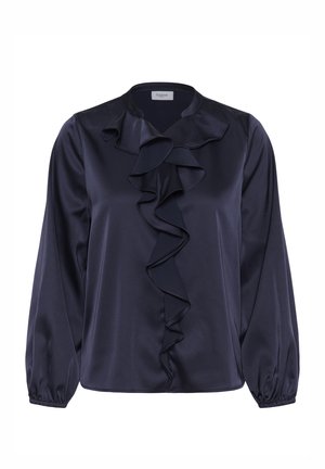 Laivastonsininen satiinipusero, jossa pitkät hihat, röyhelöinen pääntiedetalji ja joustavat hihansuut. Sileä pinta, rento istuvuus ja pyöreä helma.