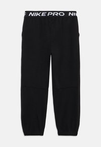 Black Nike Pro athletic pants with a white branded waistband. Made of a smooth material with a tapered design and elastic cuffs.
