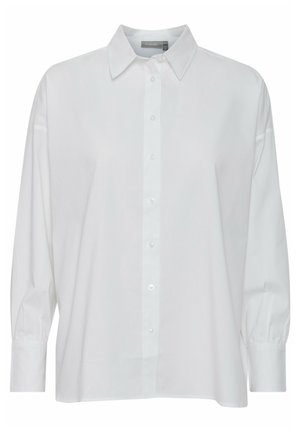 Fehér gombos ing hosszú ujjakkal, klasszikus gallérral, enyhén laza szabású és sima pamut anyagból készült. Elülső gombolással rendelkezik.