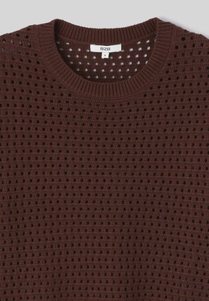 Pull en laine brun avec un design perforé ouvert, un col rond et des poignets côtelés. Étiquette visible avec la taille "S."