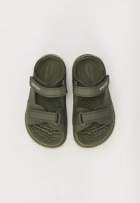 Green Geox sandals with a textured footbed, two adjustable Velcro straps, and perforated detailing for ventilation.