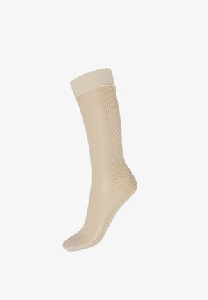 Calzino beige al ginocchio con un motivo a rete a diamante testurizzato e una banda superiore liscia. Realizzato in materiale elastico e traspirante.
