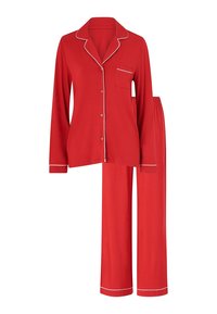 Rode pyjama set met een lange mouwen overhemd met knopen en een zak, en bijpassende broek, afgewerkt met witte accenten en een relaxed fit.