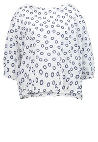 Blouse blanche fluide avec manches trois-quarts, présentant un motif de cercles irréguliers bleu marine éparpillés.