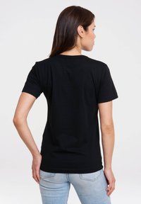 Black cotton t-shirt with short sleeves and a round neckline, featuring a plain design and relaxed fit, viewed from the back.