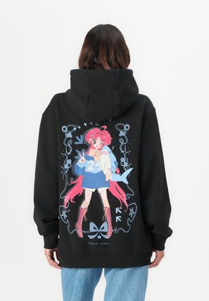 Black hoodie featuring colorful graphic on back of a character with pink hair, wearing a blue top, with long pink accents and decorative elements.