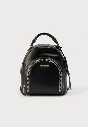 Black leather backpack with rounded shape, gold hardware, and decorative stitching along the front. Features a top handle and adjustable straps.
