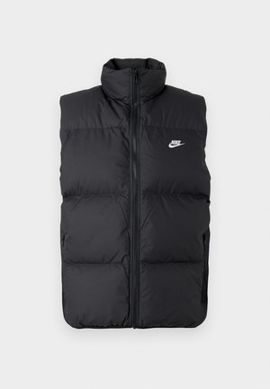 Must mängitud, lamedate käisteta musta padi jakk kõrge kraega, esine lukuga, küljetaskudega ja rinnal valge Nike logo.