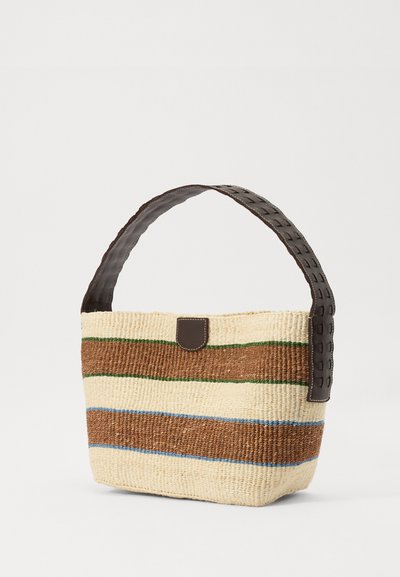 Woven straw bag in cream, brown, green, and blue stripes. Features a dark brown, detailed handle and a leather strap accent. Classic shape.