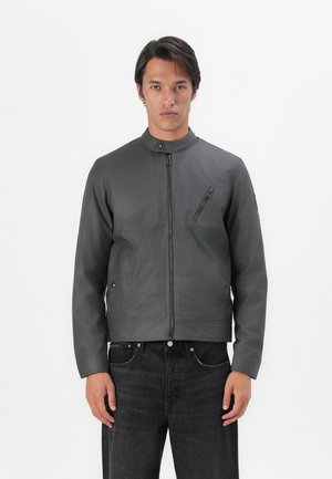 Gray lightweight jacket with a stand collar, full front zipper, and a diagonal zippered pocket. Smooth texture and tailored fit.