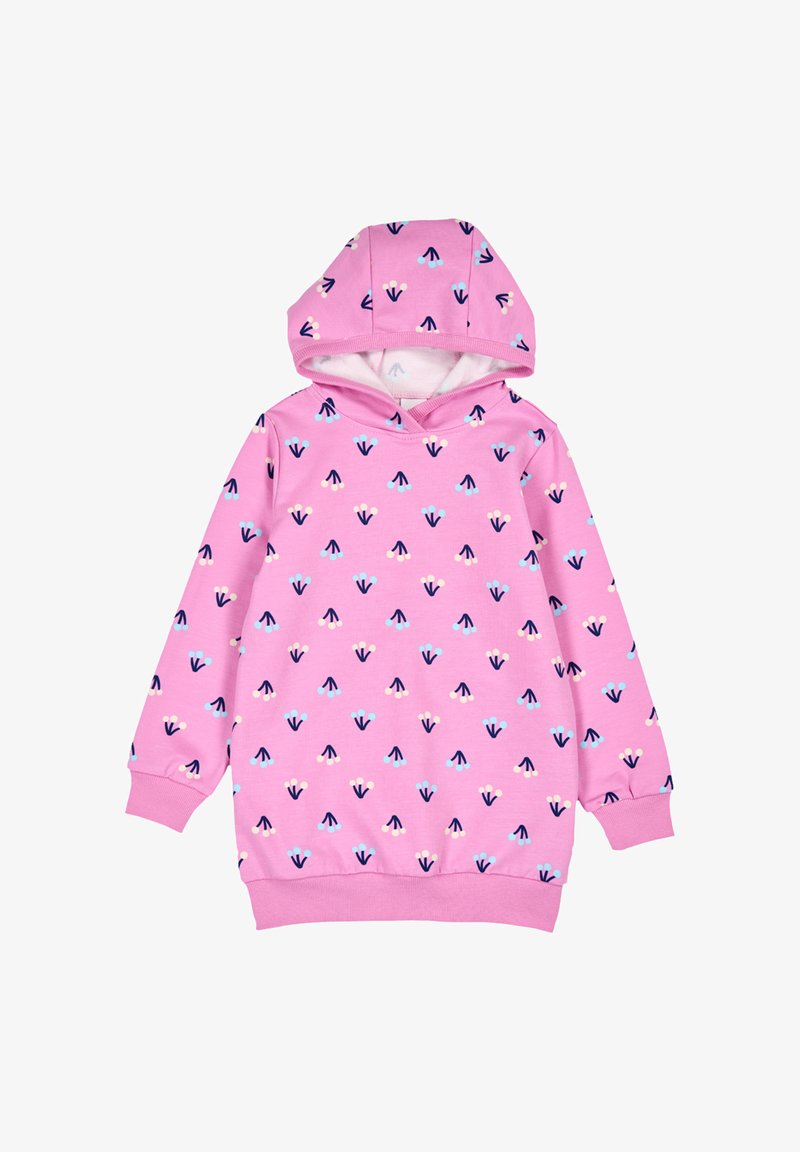 Vaatehuppari vaaleanpunaisena, pehmeällä pinnalla, jossa on toistuva kuvio pienistä sinisistä ja tummansinisistä nuolista sekä vaaleanpunaisia yksityiskohtia.