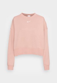 Rosa kortärmad sweatshirt gjord av mjukt material. Har en rund halsringning och långa ärmar med ribbade mudd. Vit Nike-logga på bröstet.
