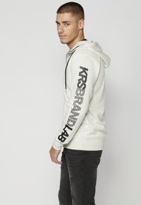 Koroshi Sudadera con cremallera - crudo