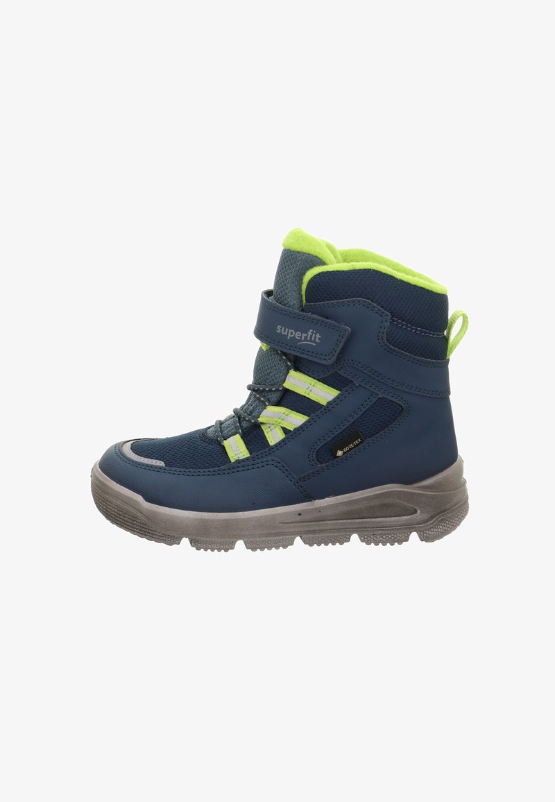 Kinderstiefel in Marineblau mit leuchtend grünen Akzenten, Klettverschlüssen, strukturiertem Stoff und einer robusten grauen Sohle; wasserdichtes Design.