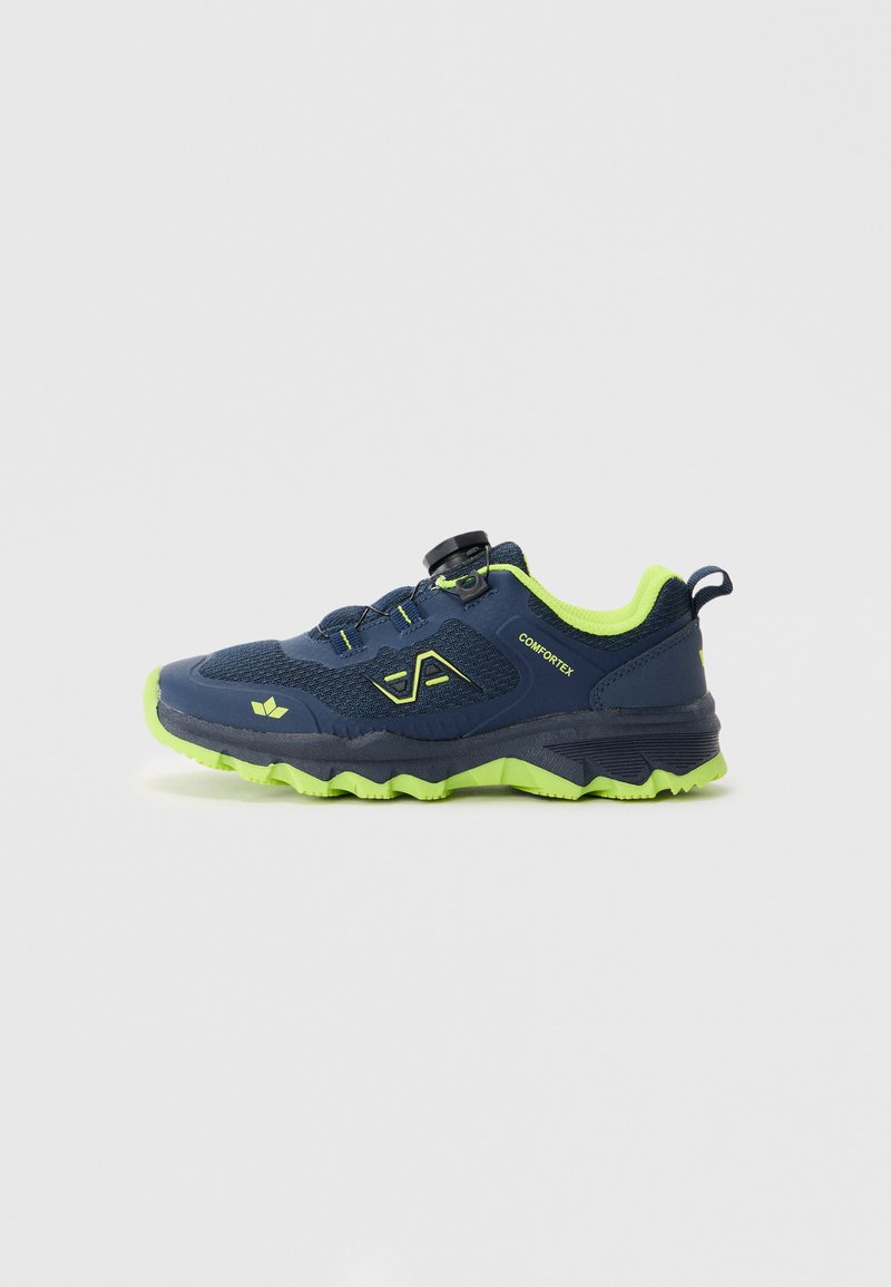 Navy blue athletic shoe with a textured upper, yellow-green accents, a round knob closure, and a rugged sole with pronounced traction patterns.
