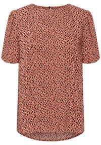 Haut à manches courtes en tissu rouille, présentant un motif dispersé de points noirs et blancs. Encolure arrondie avec une fermeture par un bouton unique au dos.