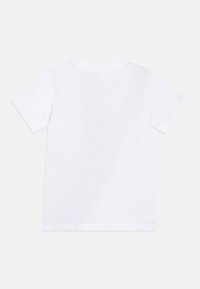 White short-sleeve t-shirt made of cotton. Features a crew neckline and a plain back. Soft texture with a clean, minimal design.