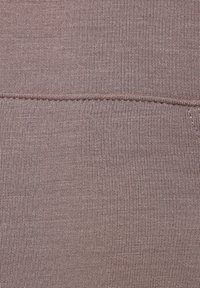 Cotton blend fabric in mauve color, featuring a smooth, textured finish with a visible seam detail. No patterns or additional accents.