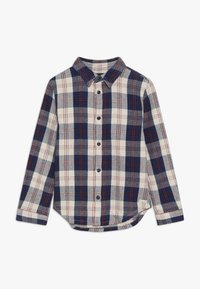 Långärmad rutig skjorta i marinblått, krämfärgat och rött. Tillverkad av flanell, med en spetsig krage, knäppning fram och rundad nederkant.