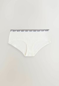 Culotte hipster pour femmes blanches avec ceinture élastique arborant le logo "NEXT" répété en noir sur fond blanc.