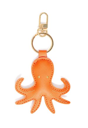 Portachiavi in pelle a forma di polpo arancione con anello e moschettone color oro, cuciture dettagliate e due piccoli occhi dorati su sfondo bianco.