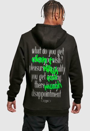 Black hoodie with graphic text on the back. Features green spray paint-style text layered over gray font. Cotton material, relaxed fit.