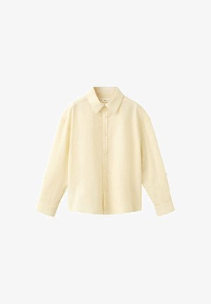 Chemise crème à manches longues avec boutons, col pointu, poignets boutonnés et coupe décontractée, présentée sur fond blanc.