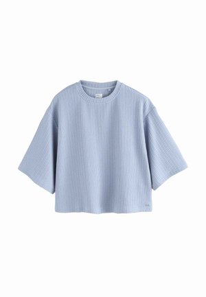 Lichtblauw cropped t-shirt gemaakt van geribbelde stof. Heeft een ronde halslijn en brede korte mouwen. Eenvoudig en functioneel ontwerp.