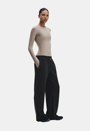 On, STUDIO PANTS WIDE - Pantalon de survêtement - black
