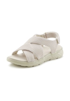 Helle beigen Sandalen mit strukturierten Textilelementen, Kreuzdesign, offener Zehenpartie und einer flexiblen, gemusterten Gummisohle.