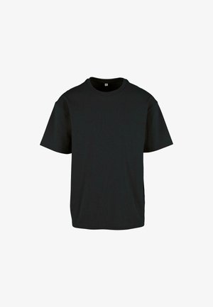 T-shirt en coton noir avec un col rond et des manches courtes ; il présente une coupe décontractée et une surface lisse et texturée.