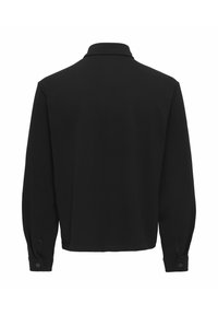 Black long-sleeve shirt with a collar, featuring buttoned cuffs and a straight hem. Made of textured fabric with a smooth finish.