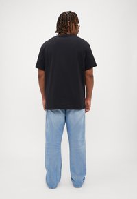 Calvin Klein Jeans SCATTERED LOGO TEE - Print T-shirt - lilac/black