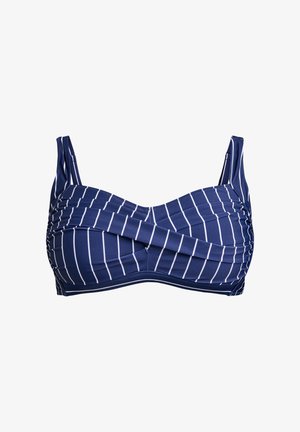 Tumši zila bikinī augša ar baltām vertikālajām svītrām. Iezīmē savilkta auduma un regulējamas siksnas, nodrošinot atbalstošu struktūru.