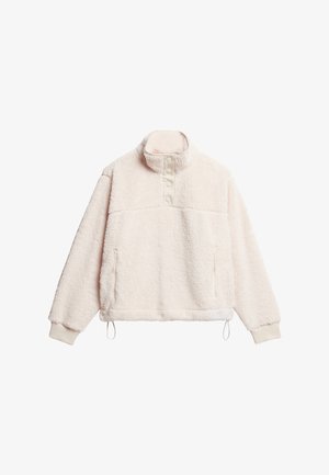 Crème-kleurige fleece pullover met een hoge kraag, knoopsluiting aan de voorkant, zijzakken en een verstelbare zoom. Zacht, textuurvol materiaal.