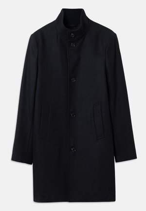 Námornícky vlnený kabát s vysokým golierom, piatimi prednými gombíkmi a dvoma bočnými vreckami; má rovný strih a hladkú textúru.