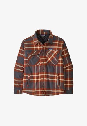 Camicia di flanella con motivo a quadri arancione, grigio e bianco. Presenta due tasche sul petto, chiusura con bottoni e collo classico. Morbido al tatto.